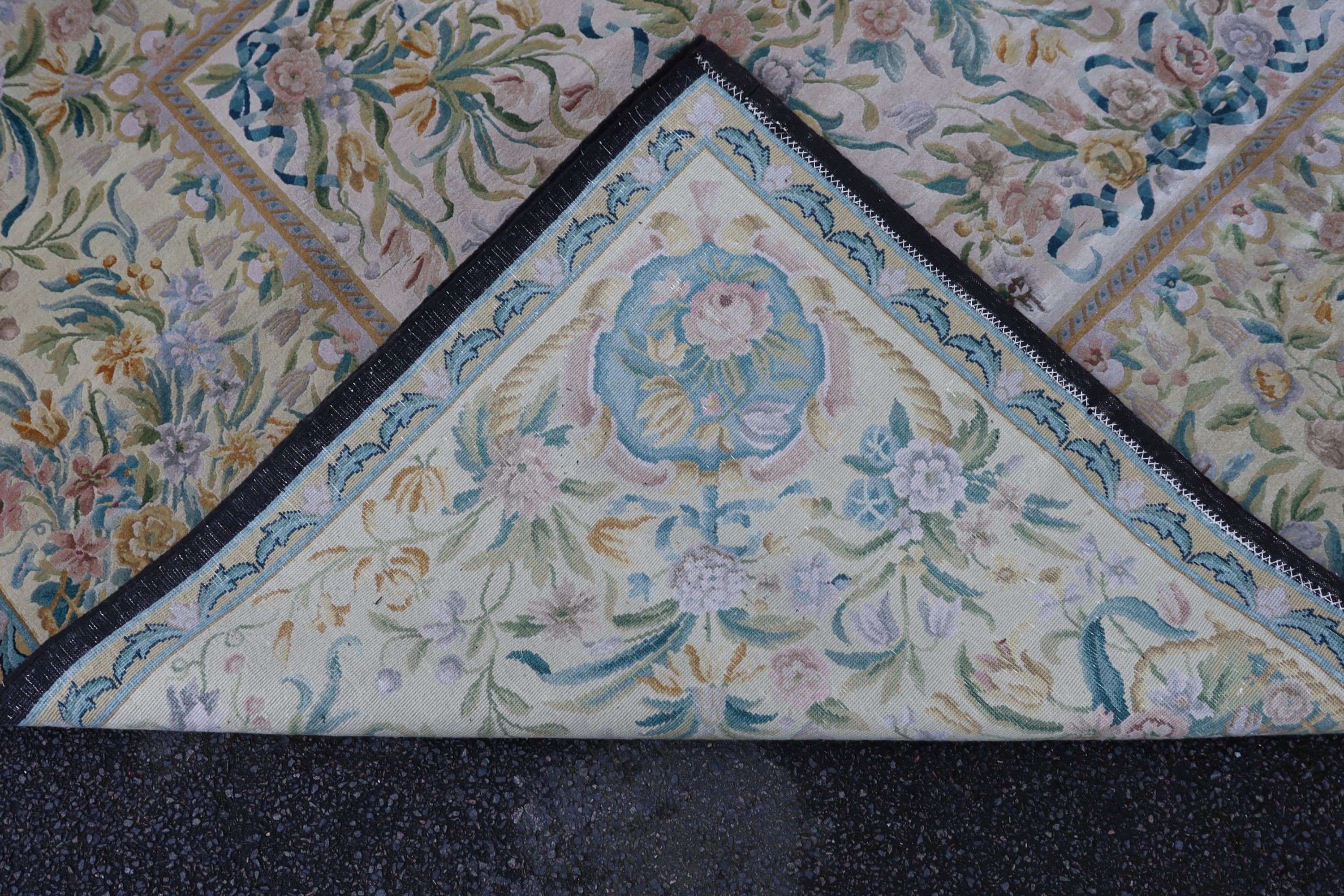 An Aubusson style ivory ground carpet, 372 x 274cm.